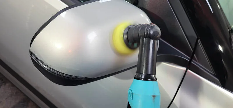 Wing mirror being machine polished on KIA EV3 at DMD Car Detailing in Paisley