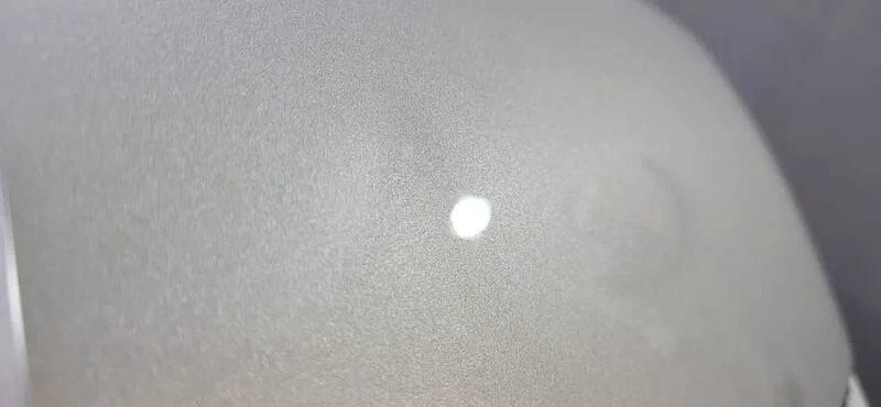 Close-up of KIA EV3 bonnet showing coated gloss finish