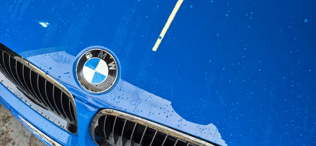 BMW before using air drier to carefully dry paintwork in Paisley