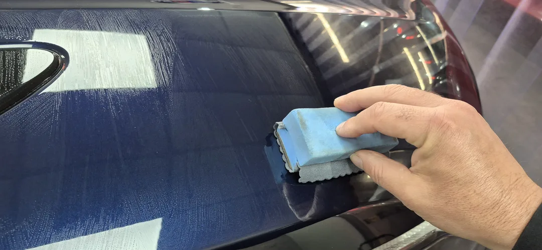 Carbon Collective ceramic coating being applied to Portofino Blue paintwork