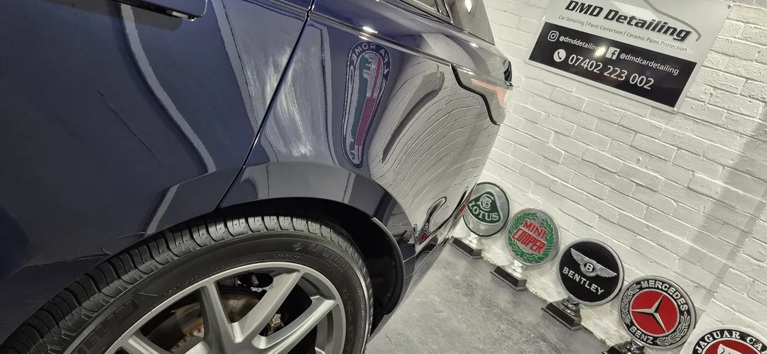 Range Rover Velar P400 nearside quarter reflecting workshop lights after ceramic coating