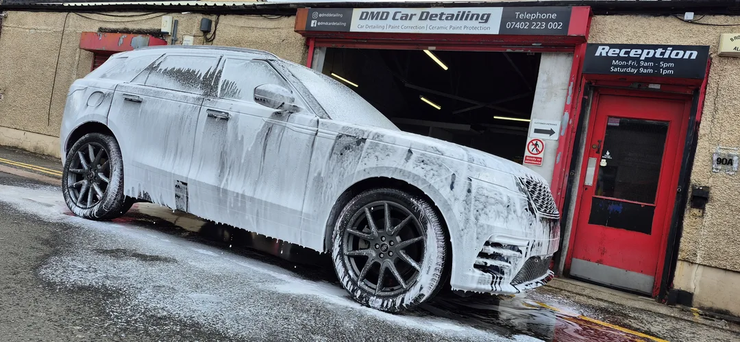 The snow foam process carried out on this Range Rover Velar safely removes loose dirt and road grime from a car's paintwork before a contact wash.