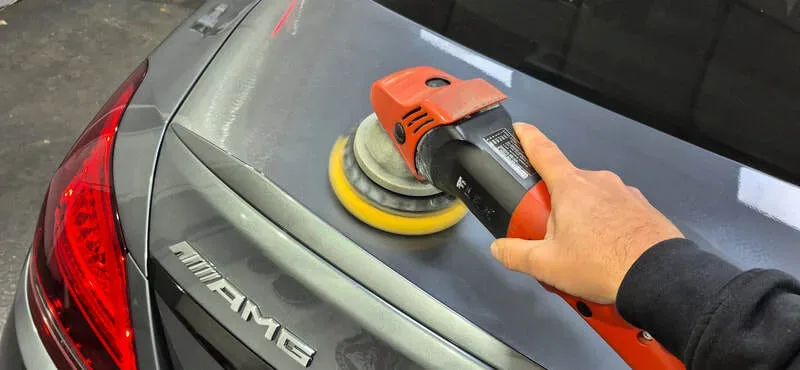 Grey Mercedes C43 going through machine polishing prior to ceramic coating in Paisley near Glasgow