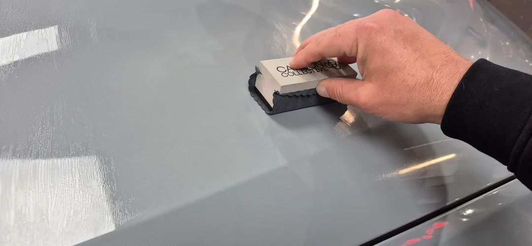 Carbon Collective ceramic coating being applied to bonnet