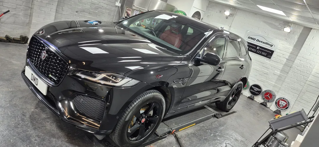 Santorini Black Jaguar F-Pace after undergoing major paint correction and ceramic coating in Paisley at DMD Car Detailing near Glasgow