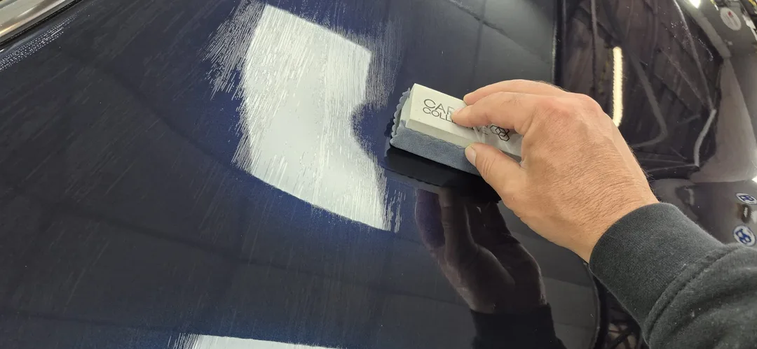 Ceramic coating being applied to bonnet on Mini Cooper at DMD Car Detailing in Paisley near Glasgow