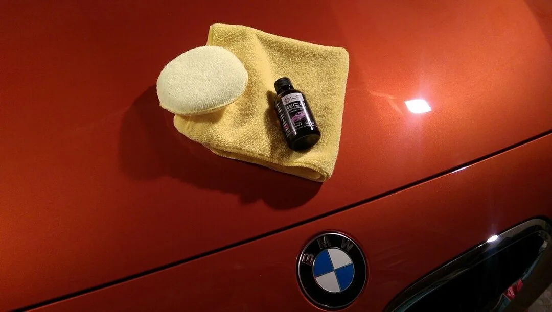 Orange BMW M140i with deep gloss finish after ceramic coating, Paisley