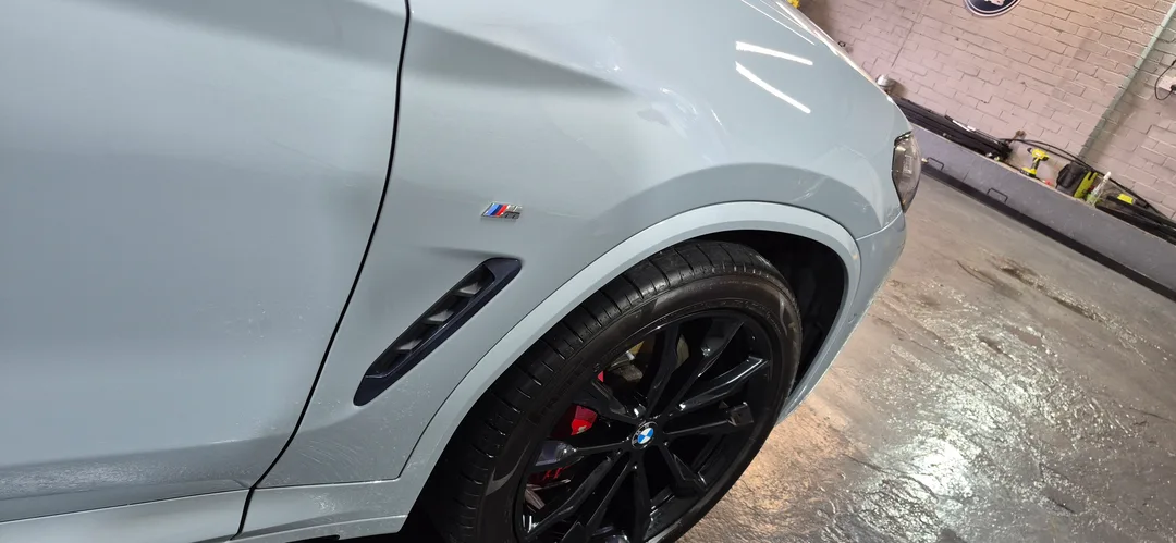 Front wing panel of BMW X4 after full detail and ceramic coating