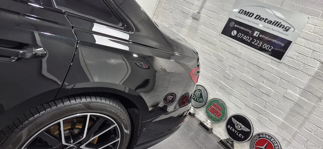 Deep gloss reflection on Audi A8 rear quarter panel following paint correction