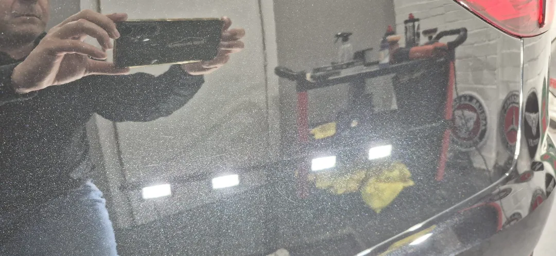 Close-up of corrected Mythos Black Metallic paintwork on Audi A8 quarter panel