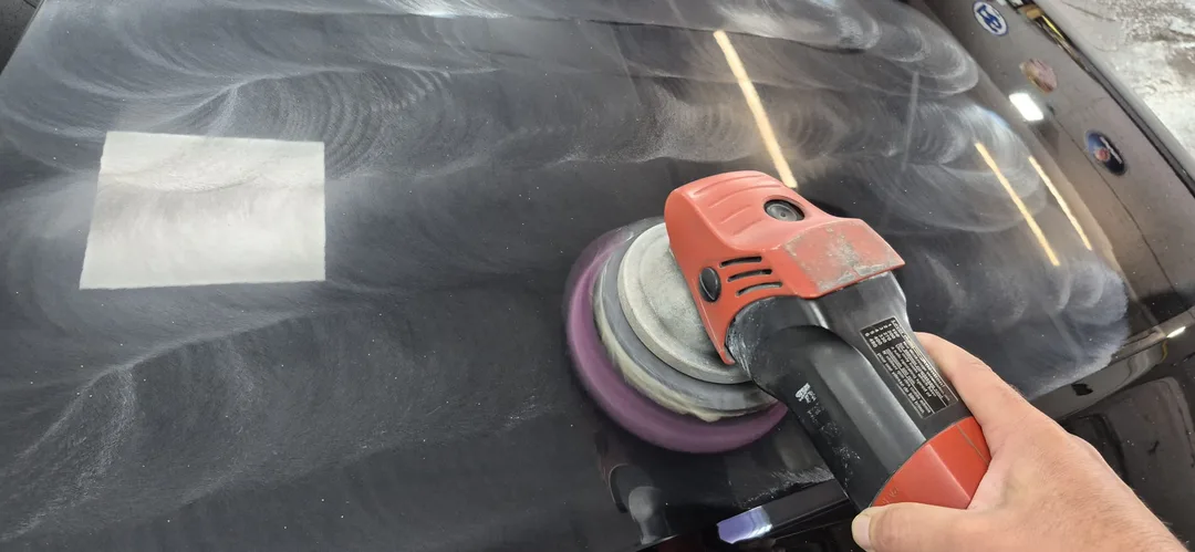 Bonnet of the Mythos Black Audi A8 being machine polished at DMD Car Detailing